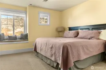 Primary Suite offers King size bed and window seat.