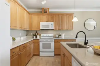 Bright, functional kitchen offering ample cabinet space and room to gather