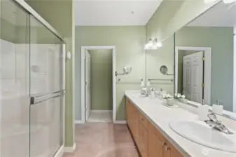 Primary bath with walk-in shower and dual vanity
