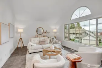 Vaulted ceilings, walls of windows....custom tile flooring and freshly painted. The living room is a room you are sure to love!