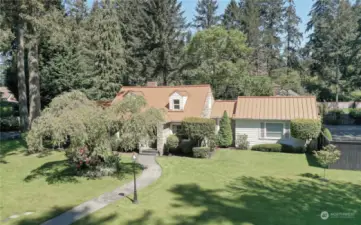 English cottage home on a shy 1/2 acre corner lot-Impeccably maintained inside and out!