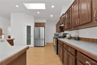 The spacious kitchen has lots of counter space and cabinets