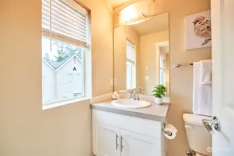 The bathroom off this bedroom has a full tub.