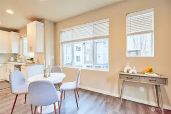 The spacious dining area with multiple windows.