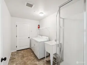 Main Level Laundry just off Garage has 3/4 Bathroom