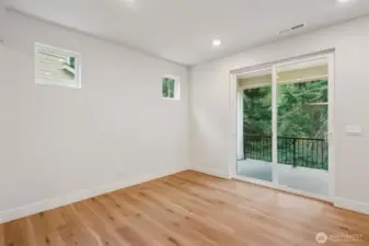 Nook area and slider to large, covered deck.  Very private lot and peek a boo view of the water.