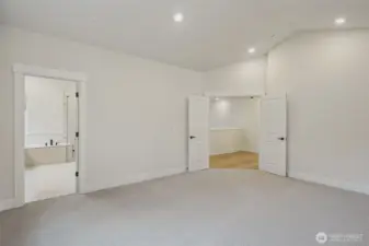 Primary bdrm - Spacious and large windows, upgraded Berber carpet and pad, can lights and prewire for future ceiling fan.  Huge 5-piece bath w/soaking tub, huge frameless tile shower with bench and large walk-in closet.