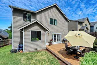 There's plenty of room for all in the fenced backyard. And the deck is easy-care composite.