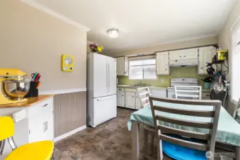 Ample storage and counter space in this bright kitchen.