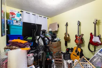 @nd bedroom, currently being used to store boxed up items for moving.