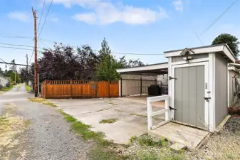 Entrance to carport and one of the sheds.