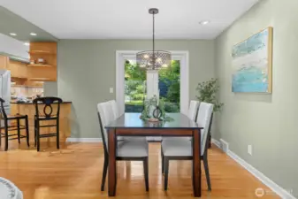 A dining room with a view of the backyard. Close to the kitchen and living area for excellent entertaining.