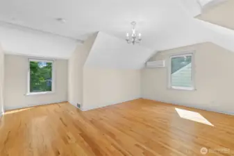 2nd upstairs bedroom with a view and plenty of room for 2 beds and a play room or art room. Vaulted ceilings!