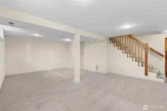 Large basement area with new carpet.