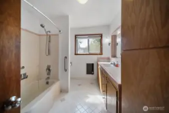 Full guest bath, virtually staged.