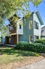 The home lives large like a standalone home with generously-sized Living and Kitchen spaces, and outdoor spaces for gardening and play!