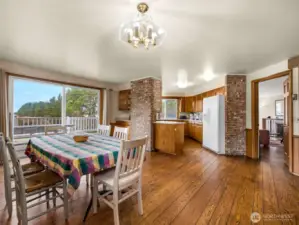 Kitchen with eating space. This room faces the deck which overlooks the dunes and has a full ocean view.