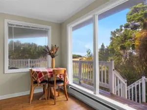 Living room (upstairs) with ocean and territory views and fireplace.