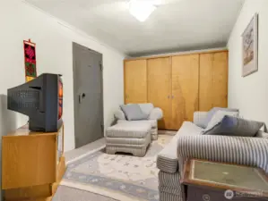 Middle media room downstairs with built in safe-storage.