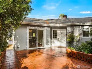 paver brick patio as the entrance. You can either take the stairs from the parking area, or there is a sloped entrance.
