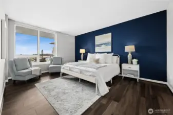 The primary suite is an oasis of calm and beauty, shown here with a king-size bed.