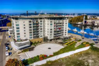 Here is an aerial view of the Esplanade showing the traffic circle convenient for quick stops. The parking garage entrance is along Dock Street to the left side. Suite 704 includes three assigned parking spaces!