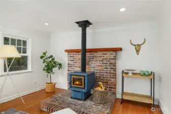 Wood burning fireplace- an option might be to remove this fire place to add a formal dining area.