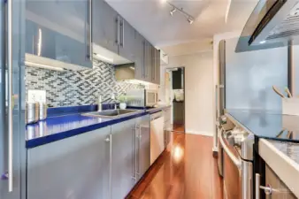 Look at the cool tile backsplash & cabinetry, modern & sleek.