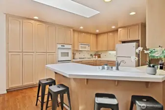 spacious kitchen open to living and breakfast nook
