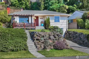 Rockery with planting and driveway to generous size garage.