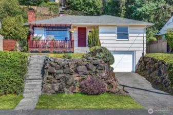 West facing home with rockery plants, excellent deck, and generous garage. Extra parking off street.