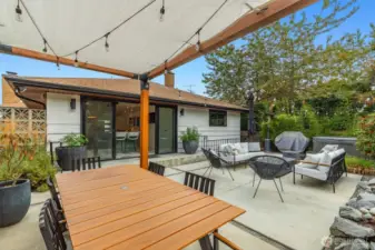 Full landscape renovation with hot tub, shed, outdoor power supply, grow beds, custom gazebo, waterfall, entry gates and light fixtures.