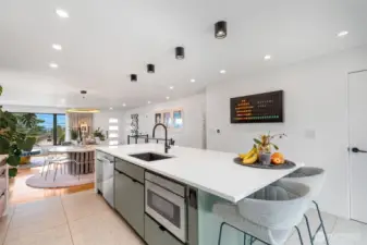 Huge quartz countertop island with eating bar.