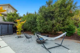 Hammock dreams and a fire pit feature on another backyard vignette.