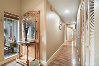 From entry looking toward bedrooms and bathroom- lots of closets and storage options