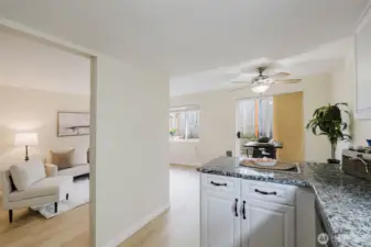Kitchen looking at living room and dining area