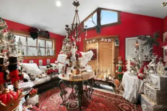 Living room with vaulted ceilings (used as part of Christmas Shop business currently)