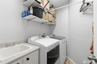 Laundry room with utility sink.