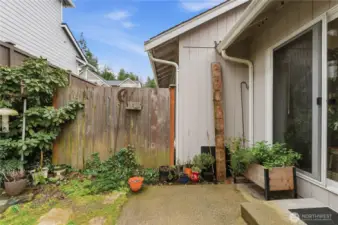 Private yard is low maintenance and partially fenced.