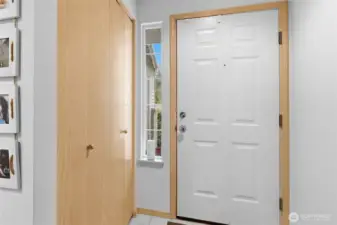 Tile flooring and spacious coat closet at entry.  Side light for the northern exposure and soft lighting throughout the day.