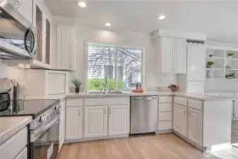 Kitchen features new LVP flooring, new SS appliances, refreshed cabinets.