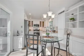 Enjoy morning coffee in this cute nook! Slider to patio.