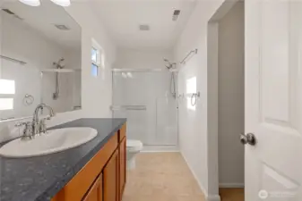 Primary bathroom walk in closet to the right