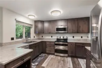 Kitchen updates include custom cabinets, quartz counter tops and a high end appliance package