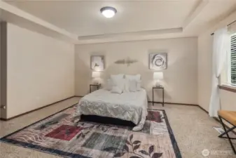 Thoughtfully designed luxurious primary suite features a custom 5-piece bath complete with a spa-like soaking tub, dual vanities, a walk-in shower, and a custom-tailored bidet.