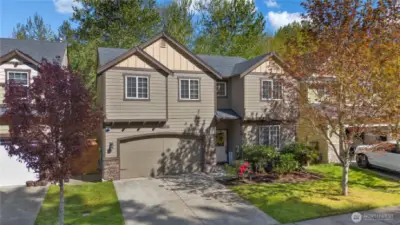 The house is situated in a serene, private setting, with the back of the property backing onto a lush greenbelt