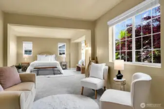 Enter the stunning primary suite, complete with an elegant sitting area.