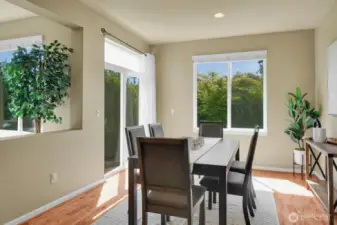 Dining room with access to the patio. So much natural light with all the huge windows!