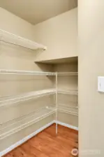 Walk-in pantry for extra storage.