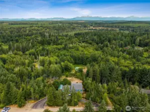 Aerial view of front, paved roundabout driveway